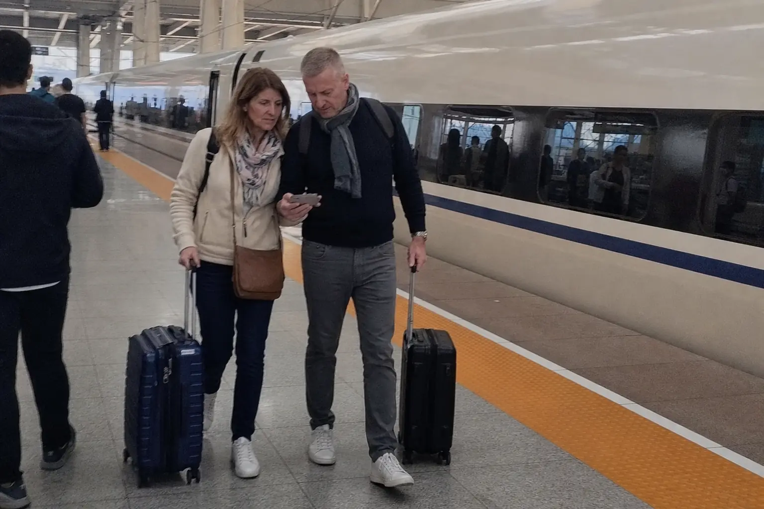Swiss travellers making a smooth high-speed rail connection