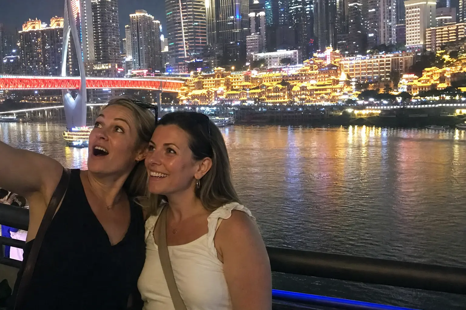 American travellers overlooking Chongqing at night